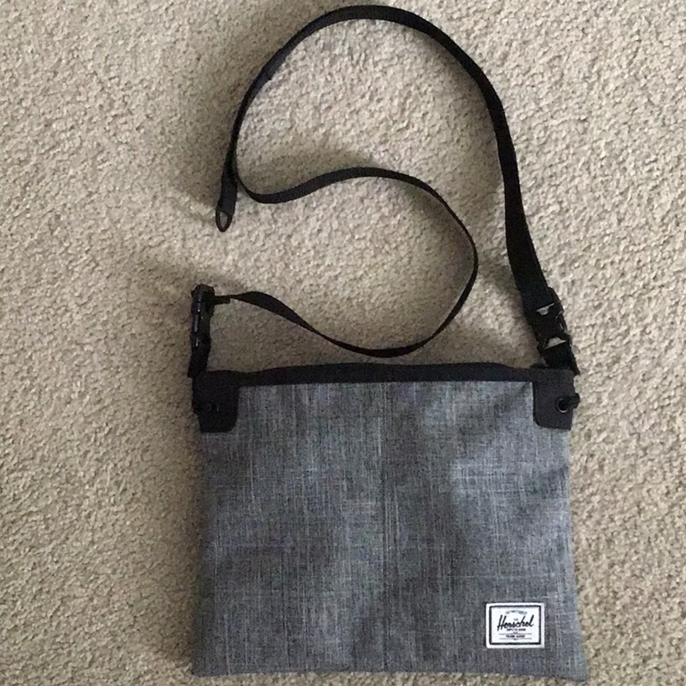 Gray, Herschel cross body bag.  Adjustable straps.